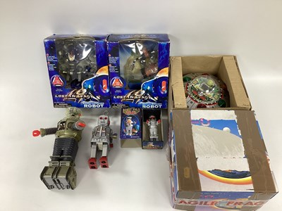 Lot 693 - Six modern battery operated and wind up toy...