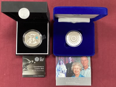 Lot 572 - Two Royal Mint UK Silver Proof £5 Coins,...