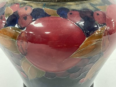Lot 1064 - A Moorcroft Pottery Biscuit Jar and Plated...
