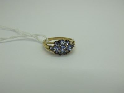 Lot 307 - A Modern Tanzanite and Diamond Cluster Dress...