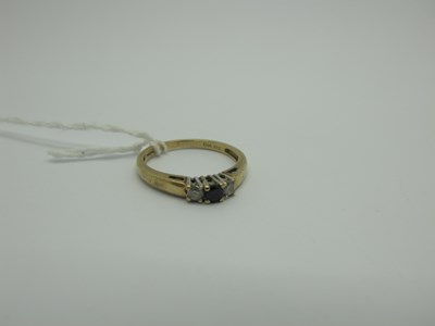 Lot 306 - A Modern 9ct Gold Sapphire and Diamond Three...