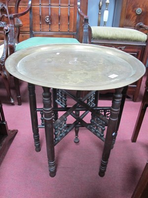 Lot 1703 - A vintage Middle Eastern brass table with...