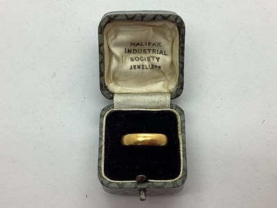 Lot 58 - A 22ct Gold Plain Wedding Band (finger size M).