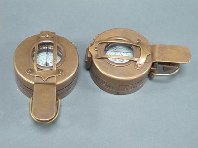 Lot 1438 - Two WWII brass marching compasses by TG.Co Ltd...