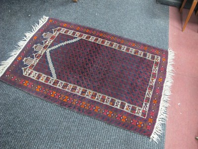 Lot 1674 - Middle Eastern Wool Tasselled Rug, with temple...