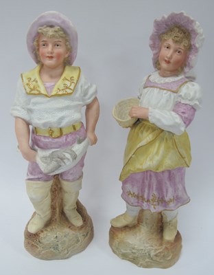Lot 1389 - A Pair of Victorian Bisque Figures of a boy...