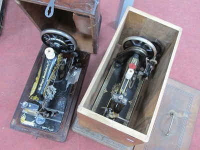 Lot 1600 - A vintage wooden cased Singer sewing machine...