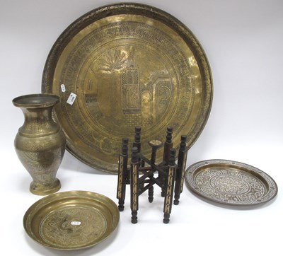 Lot 1448 - Islamic Brass Engraved Trays, 59cm, smaller...