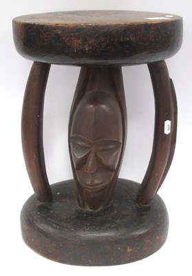 Lot 1450 - African Stool, with a circular top, shaped...
