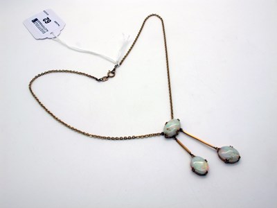 Lot 62 - An Opal Negligee Pendant, oval cabochon set,...