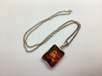 Lot 190 - A Hallmarked Silver Amber Coloured Pendant, of...