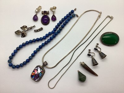 Lot 230 - A Modern Oval Cabochon Pendant, within a plain...