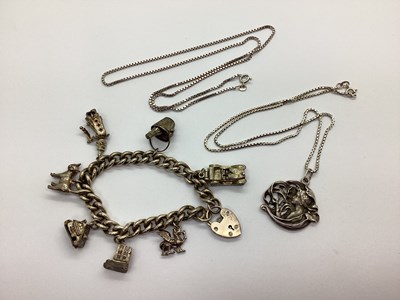 Lot 191 - A Hallmarked Silver Curb Bracelet, with seven...