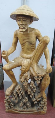 Lot 1594 - A Large Hand-Carved Wooden Fisherman Sculpture,...