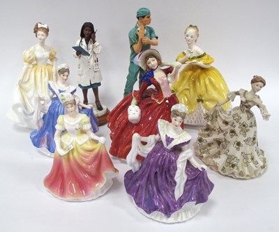 Lot 1188 - Figurines, including three Royal Doulton...