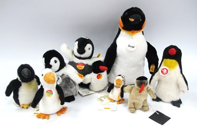 Lot 1443 - Eight Steiff Penguin Soft Toys, including...