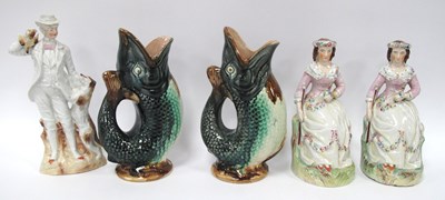 Lot 1269 - A Pair of Majolica Glazed Fish Jugs/Pitchers,...