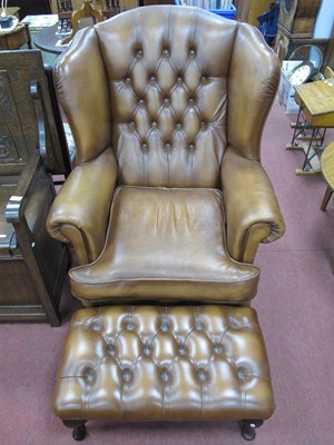 Lot 1631 - Tan Leather Button Back Wing Chair, on...
