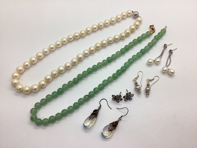 Lot 228 - A Single Row Polished Jade Bead Necklace, of...