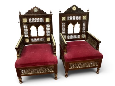 Lot 1546 - A pair of Islamic inlaid armchairs with...