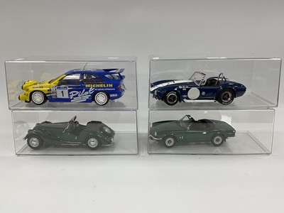 Lot 707 - Four 1:18 Scale Diecast Model Cars comprising...