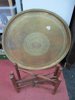Lot 1595 - A Middle Eastern Brass Table with Brass Top...