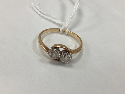 Lot 92 - A Two Stone Diamond Ring, claw set within an...
