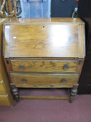 Lot 1607 - 1930s Oak Bureau, with fall front over two...