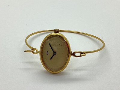Lot 390 - A Minimalist Style Ladies Wristwatch, the oval...