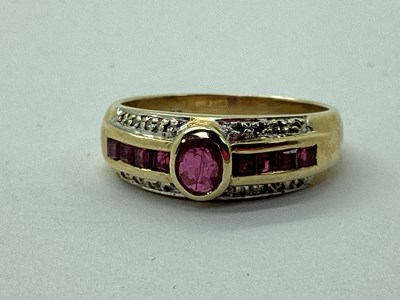 Lot 117 - A Modern Stone Set Dress Ring, rubover set...