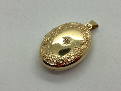 Lot 133 - A Modern 9ct Gold Diamond Set Oval Locket...