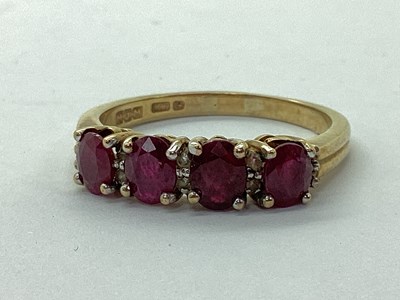 Lot 131 - A Modern 9ct Gold Four Stone Dress Ring, oval...