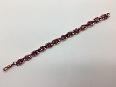 Lot 176 - A 9ct Rose Gold Amethyst Set Bracelet, of curb...