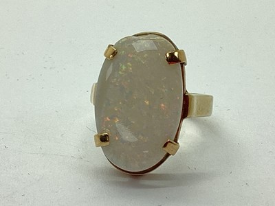 Lot 111 - A 9ct Gold Large Opal Single Stone Ring, four...