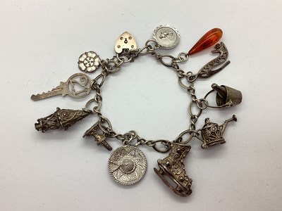Lot 220 - A Fancy Curb Link Charm Bracelet, to...