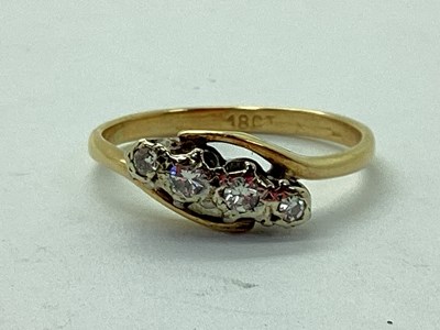 Lot 123 - An Illusion Set Four Stone Ring, within...
