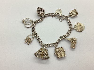 Lot 221 - A Curb Link Charm Bracelet, to hallmarked...