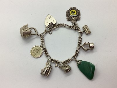 Lot 222 - A Figaro Link Charm Bracelet, to hallmarked...