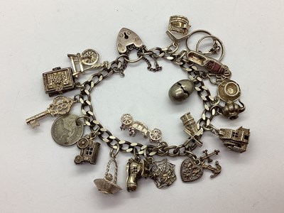 Lot 215 - A Flat Curb Link Charm Bracelet, to hallmarked...