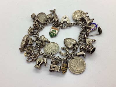 Lot 212 - A Curb Link Charm Bracelet, to heart shape...