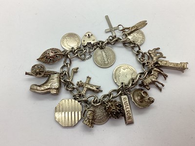 Lot 223 - A Curb Link Charm Bracelet, to hallmarked...