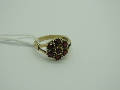 Lot 291 - A 9ct Gold Garnet Cluster Ring, rubover set of...
