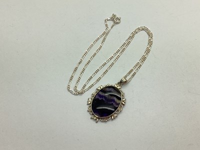 Lot 158 - A Bue John Pendant, oval collet set, within...