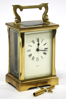 Lot 1497 - A Brass Carriage Clock with handle, enamel...