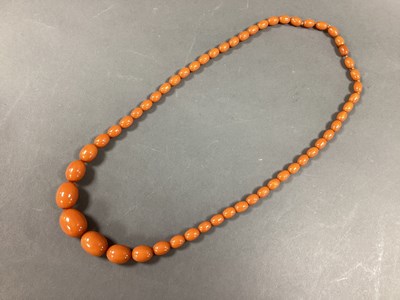 Lot 208 - A Single Strand Graduated Amber Colour Bead...