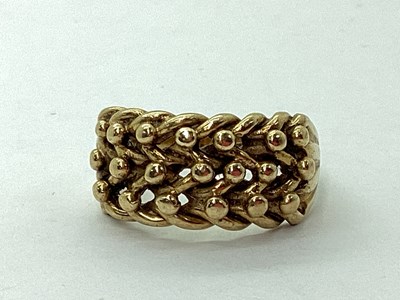 Lot 67 - A 9ct Gold Keeper Style Ring, the textured...
