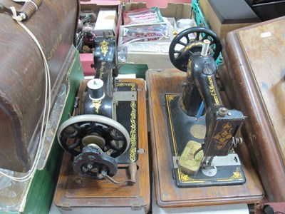 Lot 1235 - Two Wooden-cased Sewing Machines: Singer 128K,...