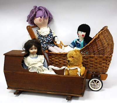 Lot 1423 - Doll with a Porcelain Head, in a doll's pine...