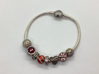 Lot 180 - Pandora Moments; A Snake Link Bracelet, with...