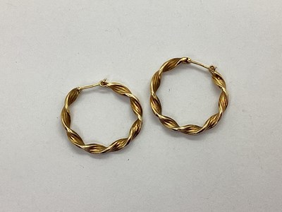 Lot 85 - A Pair of Twist Style Hollow Hoop Earrings,...